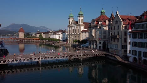 Low-flight-over-the-hisoric-center-of-Lucern-on-the-shores-of-river-Reuss