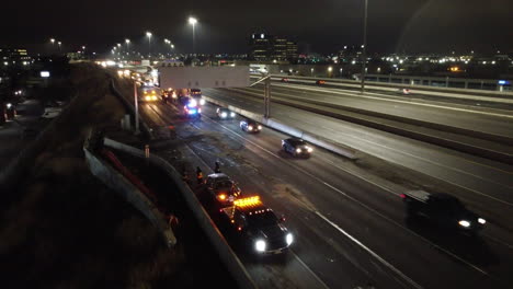 -Drone-footage-of-nighttime-highway-cleanup-after-an-accident-with-emergency-services-clearing-ail-spill-causing-a-traffic-jam
