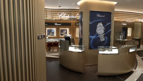Interior-shot-of-luxury-watch-store-with-extravagant-valuable-wristwatch-branding-counter-display