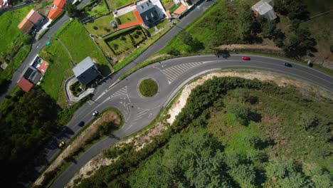 Aerial-Topdown-Of-Traffic-At-The-Roundabout-Near-Playa-de-Caion-In-Coruna,-Spain