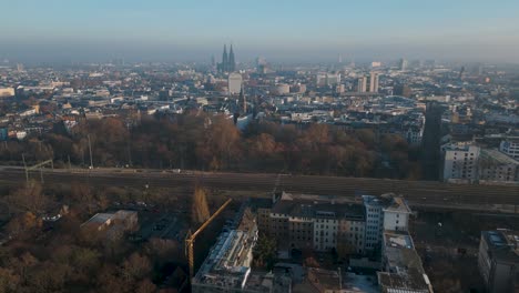 Fast-drone-flight-over-the-panorama-of-Cologne-towards-Cologne-city-center-in-winter