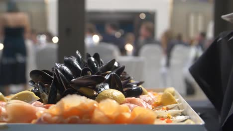 Healthy-snacks,-sea-food-and-muscles-being-served-at-wedding