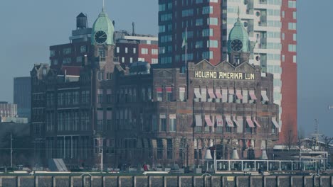 Beautiful-old-architectural-building-standing-next-to-the-canal-of-Rotterdam,-The-Netherlands