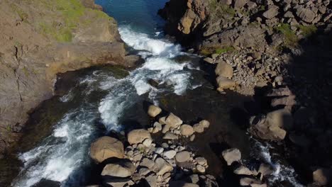 Powerful-mountain-river-flow-through-rocky-terrain,-aerial-drone-view