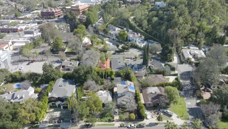 Drone-shot-flying-over-Encino-neighborhood-and-houses-in-Los-Angeles
