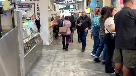 Walking-through-busy-Grand-Central-Market,-people-in-Los-Angeles-marketplace