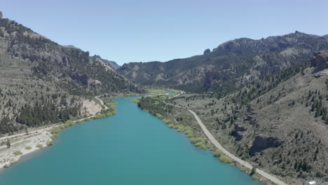 AERIAL---Beautiful-turquoise-Limay-River-in-Valle-Encantado,-Patagonia,-Argentina