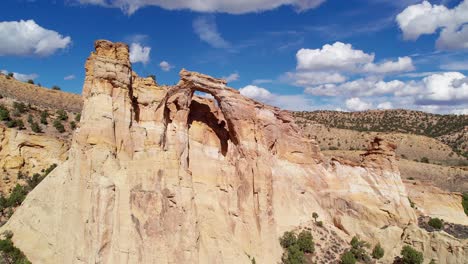 Forwarding-drone-shot-of-a-big-cliff-from-Grosvenor-Arch,-Utah,-USA
