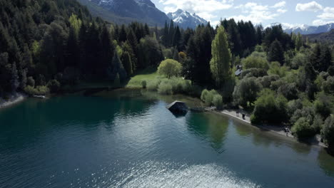 AERIAL---Moreno-Lake-and-Colonia-Suiza,-near-Bariloche,-Rio-Negro,-Argentina,-tilt-up-forward