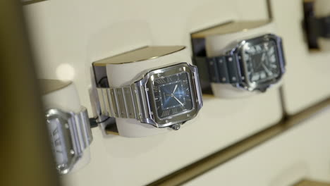 Luxury-watches-in-display-for-sale,-close-up-vertical-view