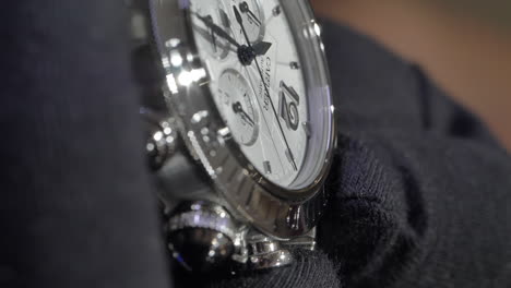 VERTICAL-Cartier-stylish-elegant-luxury-silver-wristwatch-showcased-in-retail-designer-store