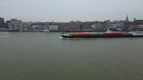 Rulica-Inland,-Motor-Freighter-Vessel-Sailing-In-The-River-Along-The-Dordrecht-City-In-Netherlands