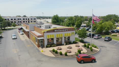 Cinematic-Establishing-Shot-of-McDonald's-Fast-Food-Restaurant-on-Typical-Summer-Day