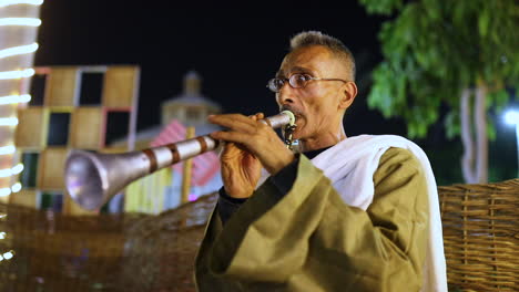 Old-man-playing-a-musical-instrument---medium-shot