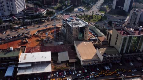 Aerial-view-over-busy-streets,-revealing-government-buildings-in-Yaounde,-Cameroon