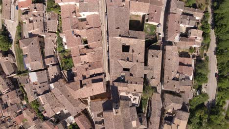 Bird's-eye-view-drone-shot-of-the-roofs-of-a-small-village-called-Loreto-Aprutino-located-in-the-region-of-Abruzzo-in-Italy-in-4k