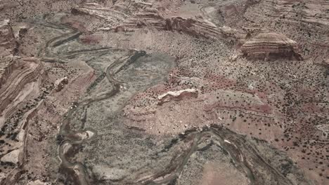 Rigid-rocky-downhill-terrian-of-Little-Grand-Canyon-San-Rafael-Swell-aerial-birds-eye-view-tilting-forward