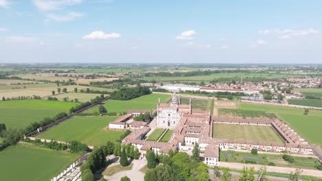 Aerial-view-of-the-Certosa-di-Pavia,-built-in-the-late-fourteenth-century,courts-and-the-cloister-of-the-monastery-and-shrine-in-the-province-of-Pavia