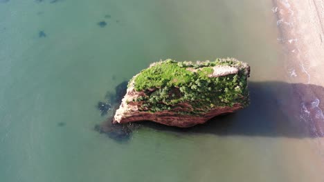 Beautiful-and-Lush-Pure-Greenery-Covers-Majestic-Rock-Pillar-at-the-Cost-Line-of-the-Tranquil-Ladram-Bay