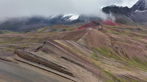 Aerial-fly-drone-view-of-Rainbow-Mountain-,-Vinicunca,-Cusco-Region,-Peru