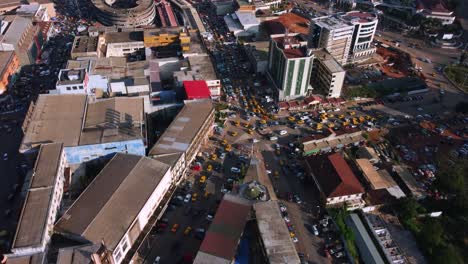 Drone-shot-over-a-traffic-jam-in-sunny-Yaounde-city,-Cameroon,-Central-Africa