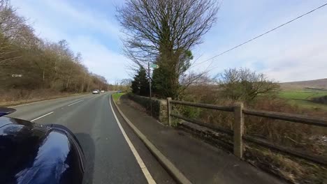 Video-footage-of-car-moving-down-a-country-road