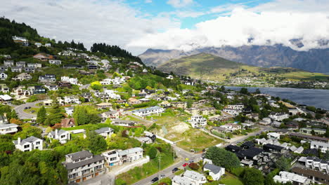 Blue-lake,-majestic-landscape-and-Queenstown-in-New-Zealand,-aerial-drone-view
