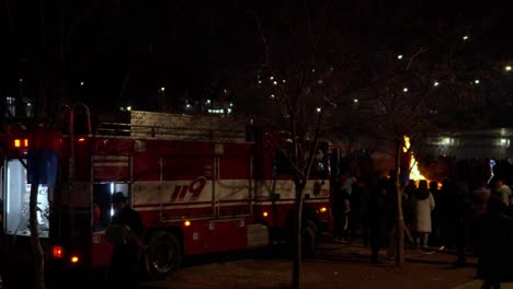 Crowd-of-People-Watching-Daljip-Burning-Ceremony-at-2023-Jeongwol-Daeboreum-Fire-Festival-in-Gangnam-at-Night-Seoul-by-Yangjae-stream