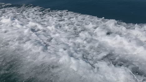 Moving-water-creates-foam-and-a-very-beautiful-visual-effect,-caused-by-the-passage-of-a-fast-boat