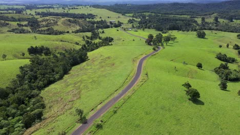 Atherton-Tablelands-aerial-above-rural-farms-and-country-road,-Queensland,-Australia