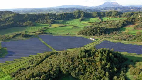 Aerial-panoramic-view-of-solar-power-plant-on-green-field