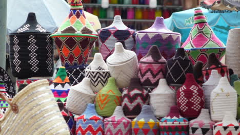 Close-up-of-colourful-decorative-objects-as-bins-in-an-Arabian-street-stall