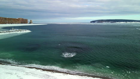 aerial-view-of-Percé-rock-in-the-winter-with-ice-on-the-ocean