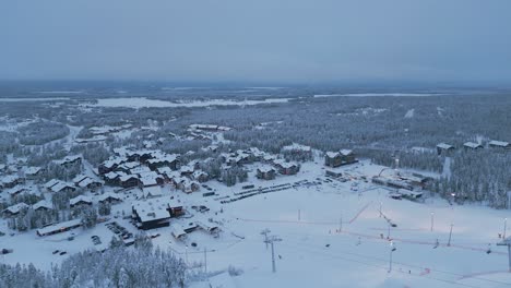 Panoramic-view-of-Levi-town,-ski-resort-and-winter-spruce-forest