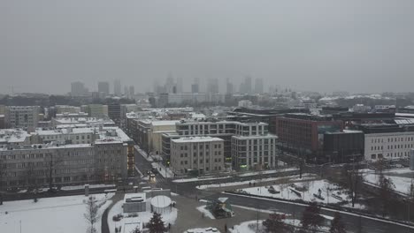 Drone-video-of-warsaw-city-skyline-on-a-snowy-and-foggy-day3