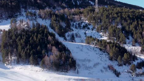 Aerial-view-of-the-cable-car,-chairlifts-and-skiers-at-the-ski-resort-in-Tarter,-Andorra