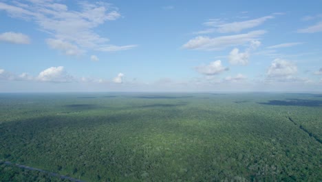 Aerial-panoramic-view-from-south-to-north,-over-deforestation-on-line-of-"Tren-Maya"-project,-in-Quintana-Roo-state,-Mexico,-at-ten-kilometres-of-"Felipe-Carrillo-Puerto