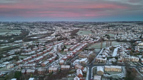 Cinematic-urban-aerial-winter-view-of-a-delicate-Pink-And-Blue-Early-Morning-Sunrise-Sky