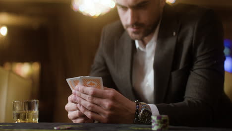 Man-playing-poker-in-the-casino.
