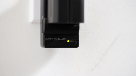Battery-charger-appliance-pulled-from-wall-home-interior-plug-socket