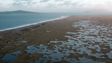 Drone-shot-of-Berneray-beach-and-the-Machair-at-golden-hour