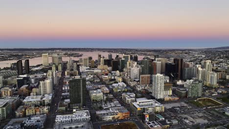 Panoramic-aerial-view-of-the-downtown-San-Diego-skyline,-dusk-in-California,-USA