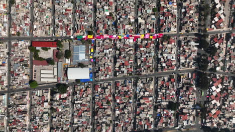 Aerial-view-above-a-ghetto,-in-sunny-Iztapalapa,-Mexico---top-down,-drone-shot