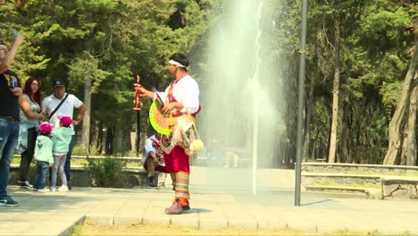 Traditional-dressed-mexican-selling-art-on-the-street