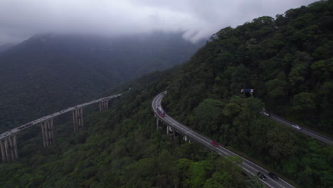 Aerial-view-around-traffic-driving-on-a-elevated-highway,-rainy-day-in-Brazil