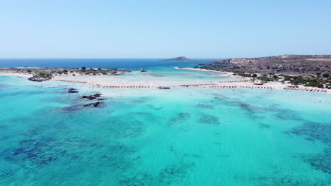 Aerial-view-orbiting-Elafonisi-beach-island,-Crete,-Greece-with-turquoise-azure-tropical-seascape