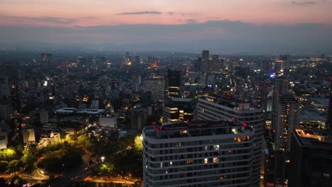 Aerial-view-of-high-rise-apartments-and-a-park-in-Polanco,-dusk-in-Mexico-city