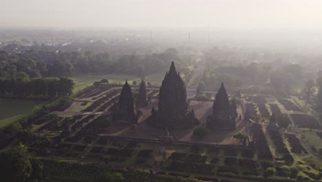 Hazy-morning-view-at-Prambanan-Hindu-temple-in-Java,-aerial