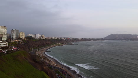 Drone-footage-of-the-coast-of-Lima,-Peru-during-sunset