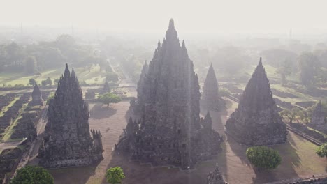 Dreamy-morning-sunlight-at-holy-Prambanan-Hindu-temple-in-Indonesia,-aerial